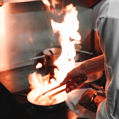 Chef with fire wok